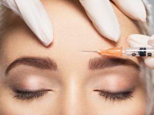 Woman getting cosmetic injection of botox near eyes | Luz MediSpa in Somers, NY