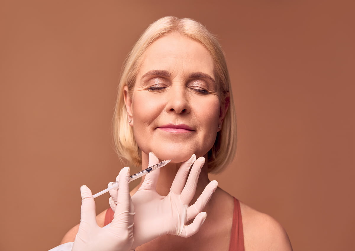 Blog 1 Old aged lady getting injection on chin | Wrinkle Relaxers injection | Luz Medispa in Somers, NY